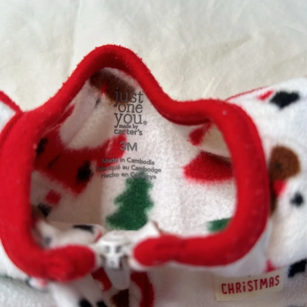 Carter’s baby girl Christmas bundle. One pair of fleece footed pajamas, one tutu